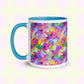 The Watercolour Rainbow Mug by My Favourite Colour is Rainbow features a vibrant abstract design with pink, blue, yellow, green, and purple splashes. It has a blue handle and interior .