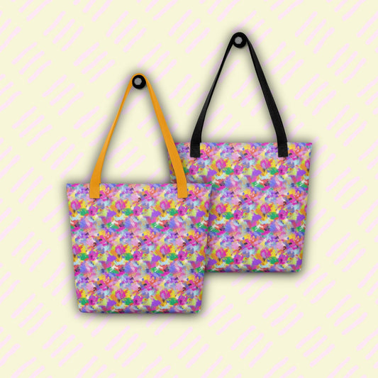 Displayed against a light background are two Watercolour Rainbow tote bags from My Favourite Colour is Rainbow, one with yellow straps and one with black.  The bag features abstract multicoloured brush strokes in pink, purple, yellow, green and blue